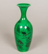 A Chinese porcelain vase Decorated with various figures and a dog-of-fo on a green ground,