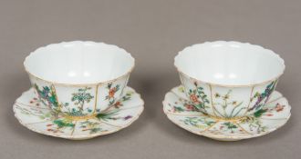 A pair of superb quality Chinese porcelain "Imperial" tea cups and saucers Each decorated with