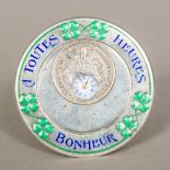 A Continental silver and enamel decorated desk clock Of circular form,