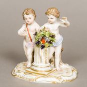 A 19th century Meissen porcelain figural group Formed as two putto with a bird encircled by a