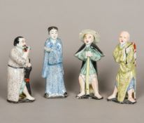 A set of four 19th century Chinese porcelain figures Each modelled standing in a different pursuit.