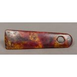 A Chinese carved russet jade pendant 10.5 cm long.