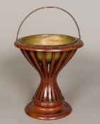 A small 19th century Dutch mahogany bucket Of waisted segmented form with removable brass interior