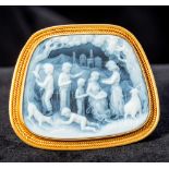 An unmarked 18 ct gold mounted hardstone cameo brooch Carved with figures and animals in a