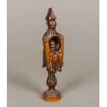 A 19th century treen nutcracker Modelled as a seated admiral above the turned screw. 16 cm high.