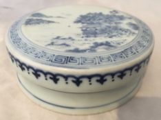 An 18th century Chinese blue and white porcelain ink box and cover Decorated with a mountainous