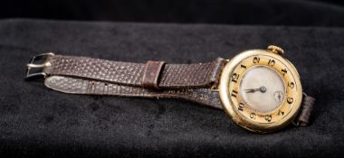 An early 20th century 18 ct gold Rolex wristwatch The silvered dial with subsidiary sweep seconds