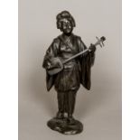 A Japanese Meiji period patinated bronze figure Modelled as a Geisha playing a shamisen,