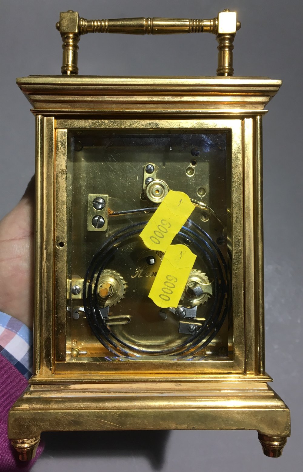 A lacquered brass cased repeating carriage clock With turned loop handle and silvered dial with - Image 4 of 8