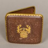 A Japanese Komai type cigarette case Of arched hinged form, the front inset with a crest,