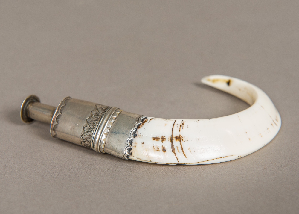 A 19th century unmarked silver mounted whistle Mounted on a boar's tusk with removable lid. 10.