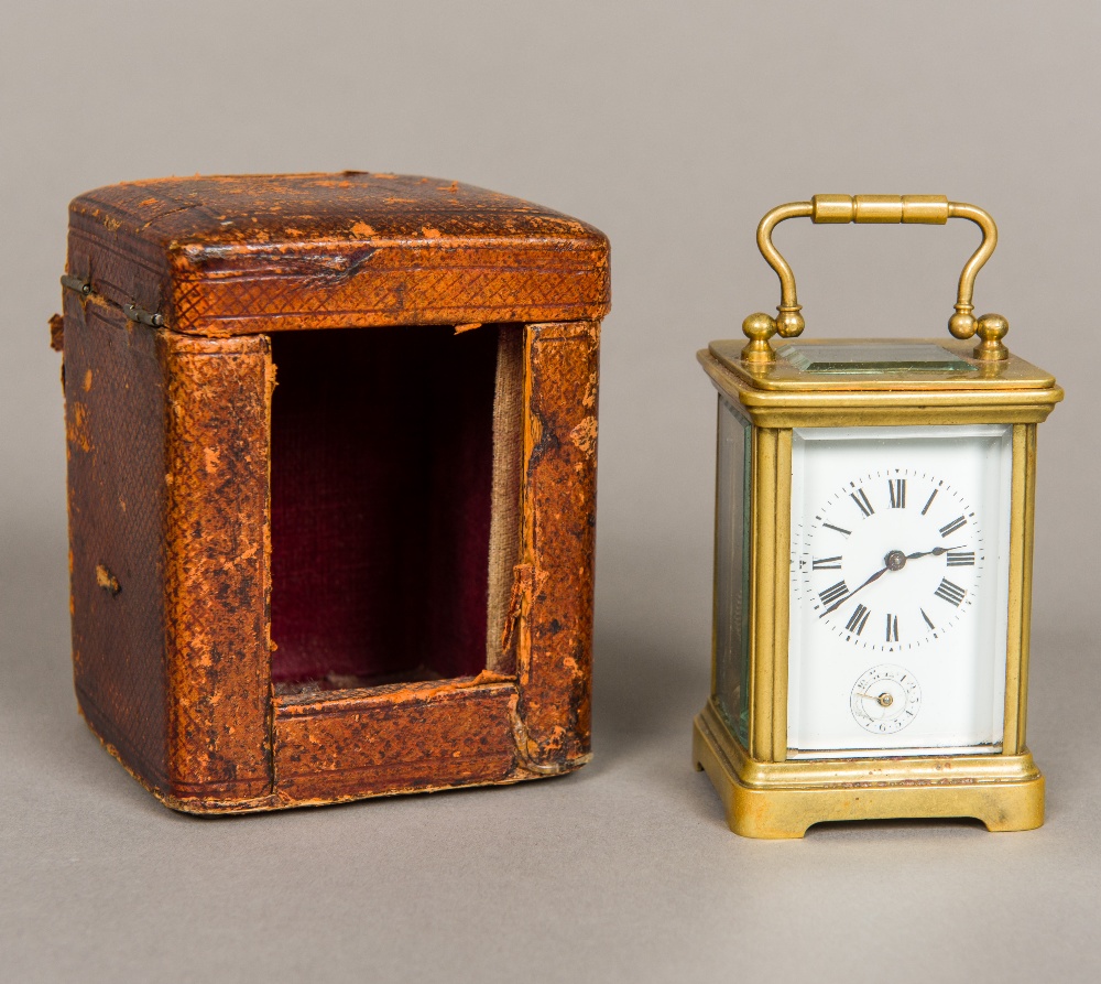 A 19th century miniature brass cased carriage alarm clock Of typical form,