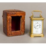 A 19th century miniature brass cased carriage alarm clock Of typical form,