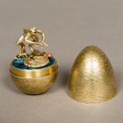 A Stuart Devlin silver gilt novelty egg, hallmarked London 1985,