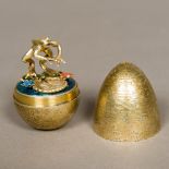 A Stuart Devlin silver gilt novelty egg, hallmarked London 1985,