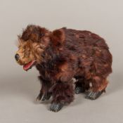 A 19th century French plush covered clockwork bear Modelled on all fours with glass inset eyes and