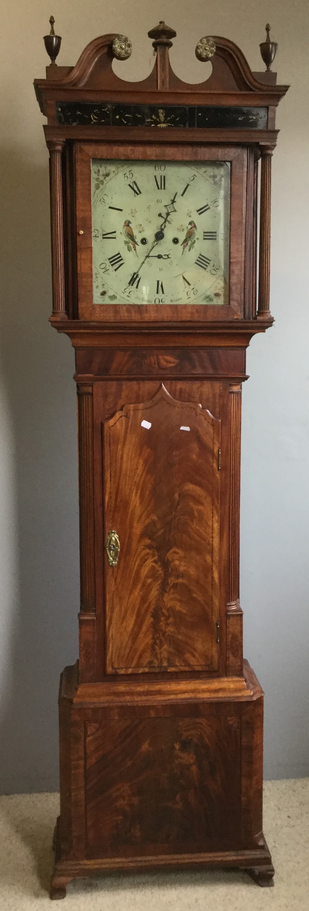 A 19th century mahogany cased eight-day longcase clock The hood with brass mounted broken swan-neck