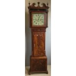 A 19th century mahogany cased eight-day longcase clock The hood with brass mounted broken swan-neck