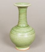 A Chinese porcelain baluster vase With allover celadon glaze. 17.5 cm high.