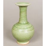 A Chinese porcelain baluster vase With allover celadon glaze. 17.5 cm high.