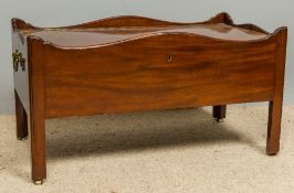 A 19th century Irish mahogany wine cooler The hinged crossbanded top enclosing the lead lined