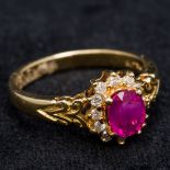 An 18 ct gold diamond and ruby cluster ring 9 cm high.