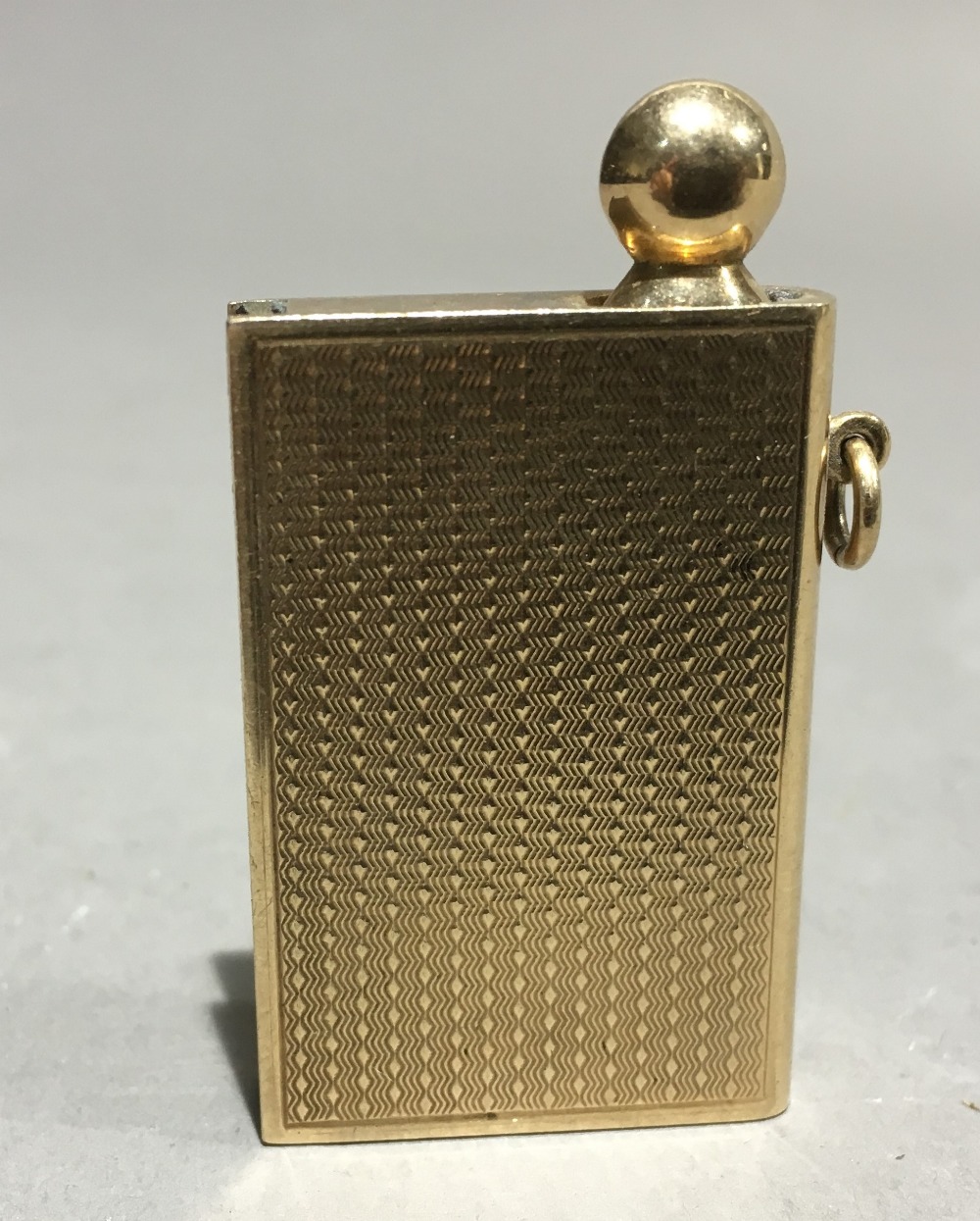 A George V 9 ct gold novelty fob striker by Asprey Modelled as a book. 5 cm long overall. - Image 4 of 9