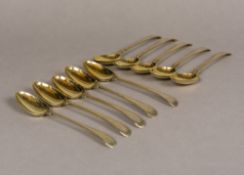 A set of ten George III silver gilt spoons, hallmarked London 1773,