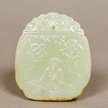 An 18th century carved celadon and russet jade pendant tablet,