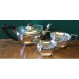 A George V silver three piece tea set, hallmarked Birmingham 1925 and 1926,