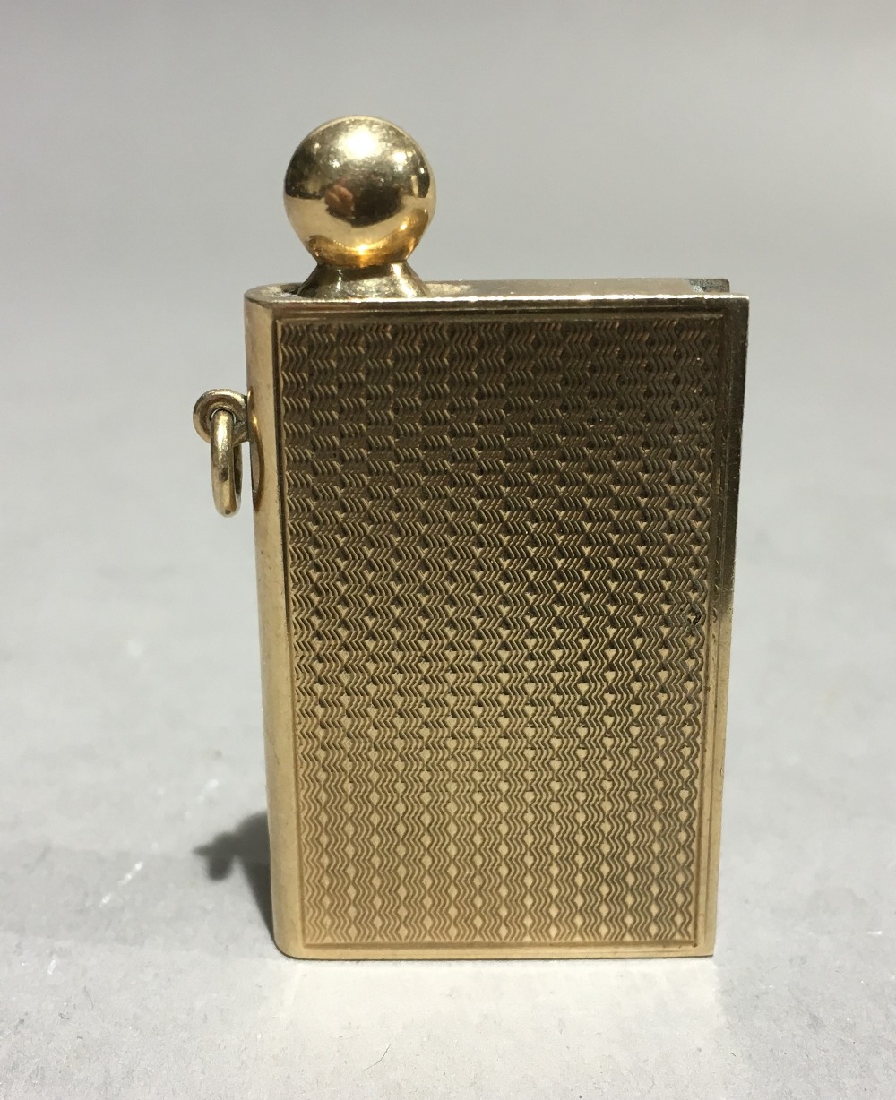 A George V 9 ct gold novelty fob striker by Asprey Modelled as a book. 5 cm long overall. - Image 2 of 9