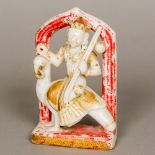 A 19th century Indian carved and polychrome decorated alabaster figure of a deity,