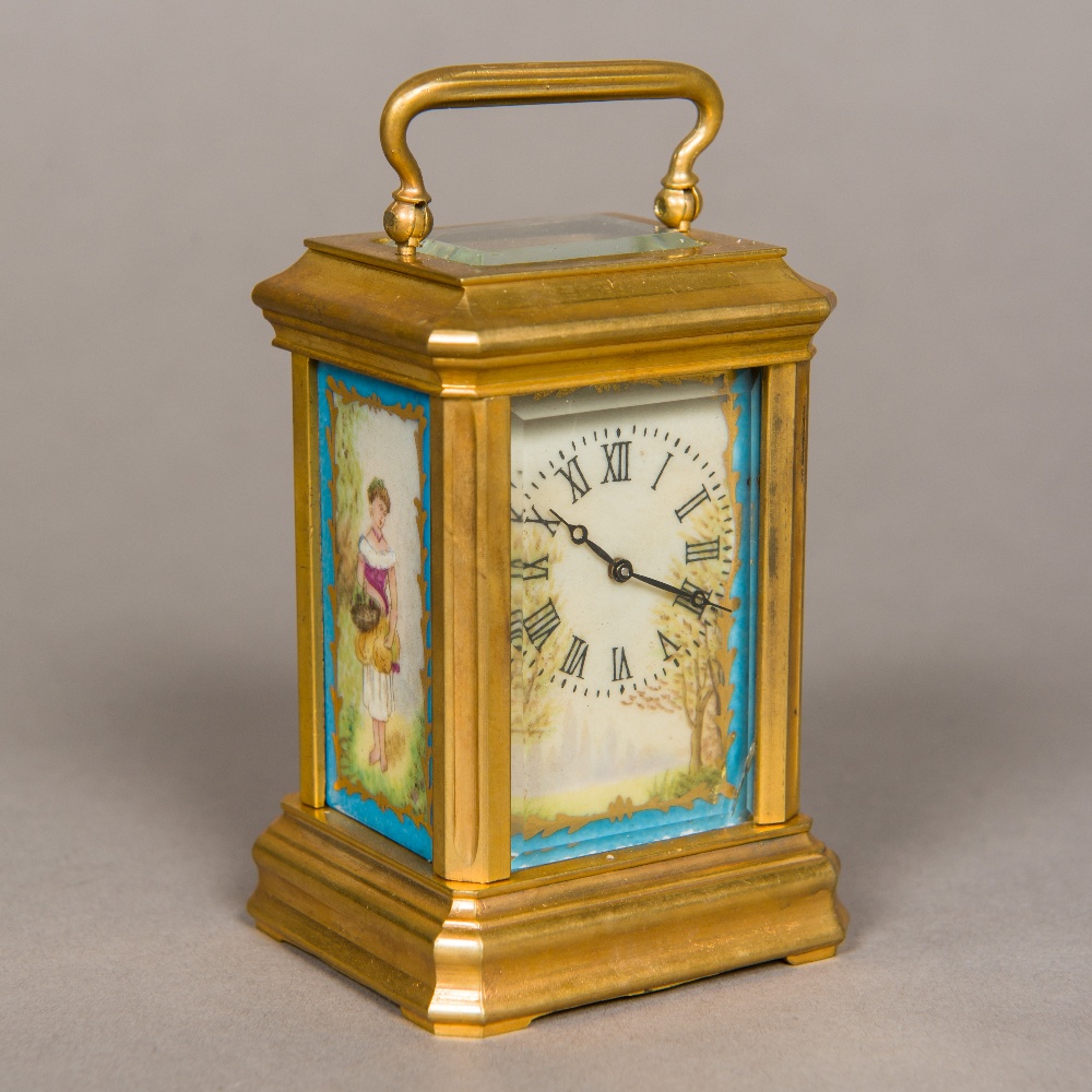 A brass cased miniature carriage clock Set with painted porcelain panels,