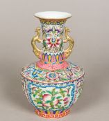 A Chinese porcelain twin handled baluster vase Brightly enamelled with pomegranate vignettes and