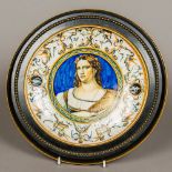 An Italian faience dish Centred with a female figure wearing a jewelled earring and laurel wreath,