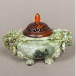 A Chinese carved jade censer Of squat bulbous form with twin dog-of-fo mask and ring handles,