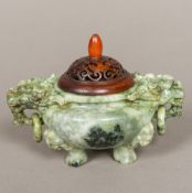 A Chinese carved jade censer Of squat bulbous form with twin dog-of-fo mask and ring handles,