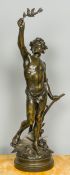 A large 19th century patinated bronze figure Modelled as a young man holding aloft a leafy spray,