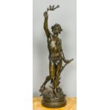 A large 19th century patinated bronze figure Modelled as a young man holding aloft a leafy spray,