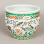 A 19th century Chinese famille verte porcelain jardiniere Typically worked with birds,