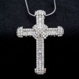 An 18 ct white gold diamond set crucifix Set with round and baguette cut diamonds,