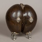 A 19th century white metal mounted coco-de-mer Hinged as a box, mounted on cast ball-and-claw feet.