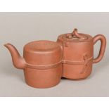 Two Chinese Yixing pottery teapots One worked as twin ribbon tied pots,