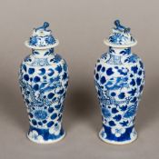 A pair of 19th century Chinese blue and white covered vases Each of slender bulbous form,