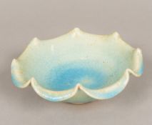 A Chinese Song type porcelain bowl With shaped rim and allover bluish glaze. 20 cm diameter.