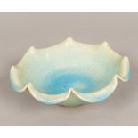 A Chinese Song type porcelain bowl With shaped rim and allover bluish glaze. 20 cm diameter.