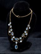 An Edwardian 9K gold moonstone set necklace 44 cm long.