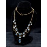 An Edwardian 9K gold moonstone set necklace 44 cm long.