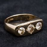 A 18 ct gold diamond three stone ring Gypsy set, the central stone spreading to approximately 0.