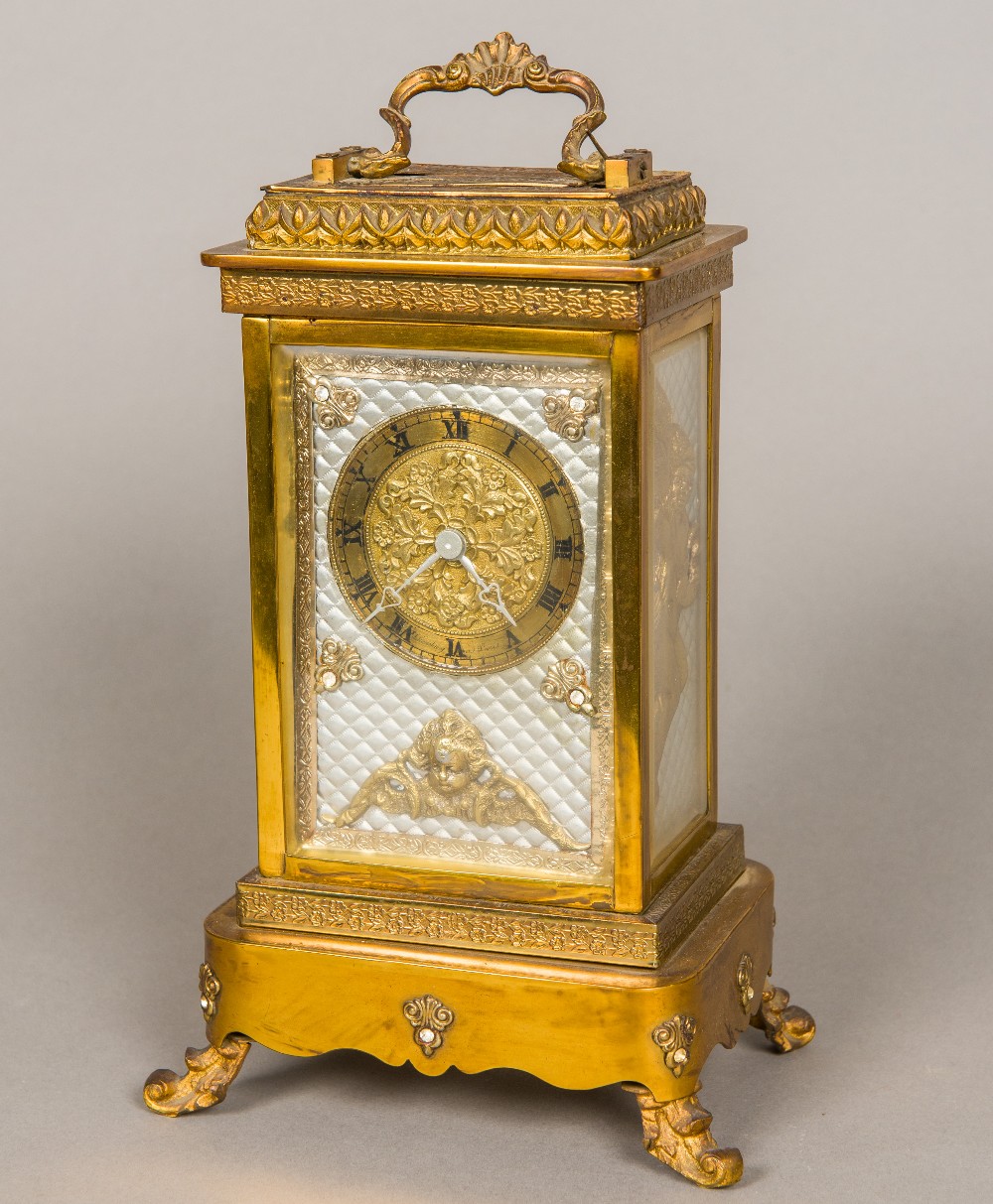 A 19th century French lacquered brass cased musical four glass mantel clock The brass dial with